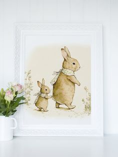 a watercolor painting of two rabbits in front of a white frame with pink flowers