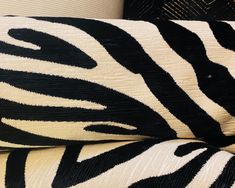 zebra print pillows stacked on top of each other