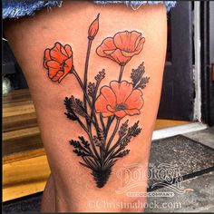 a woman's thigh with flowers on it