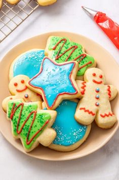 cookies decorated with icing and decorations on a plate