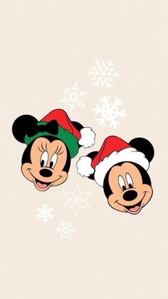 mickey and minnie mouse christmas wallpaper with snowflakes in the background, two cartoon characters