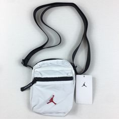 Brand New With Tags Jordan Jumpman Waist Bag Fanny Pack Belt Festival Pouch Crossbody White New White Shoulder Bag With Zipper Pouch For On-the-go, Trendy White Chest Bag For On-the-go, White Mobile Phone Pouch For Everyday, Everyday White Mobile Phone Pouch, White Rectangular Pouch With Cell Phone Pocket, White Rectangular Chest Bag For Daily Use, Casual White Shoulder Bag For On-the-go, Casual White Shoulder Bag For Travel, White Rectangular Chest Bag