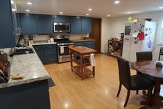 the kitchen is clean and ready to be used for cooking or eating, while also being used as a dining room