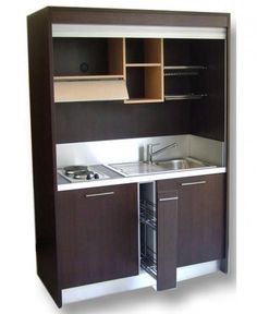 a kitchen with cabinets and a sink inside of the cupboards on the wall above it