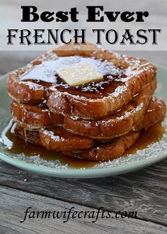 a stack of french toast with powdered sugar and butter on top sitting on a plate