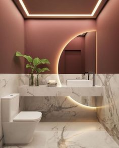 a white toilet sitting next to a sink in a bathroom under a round light fixture