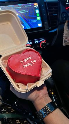 a heart - shaped cake in a foam container with the words happy valentine's day written on it