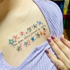 a woman's chest with colorful stars and the words, you know what they are