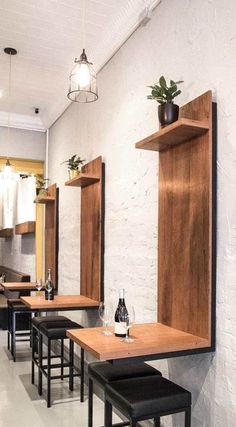 an empty restaurant with wooden tables and stools