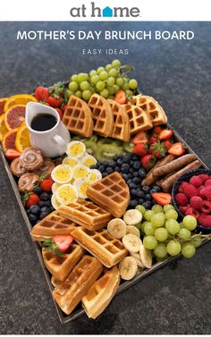 mother's day brunch board with fruit and waffles on it