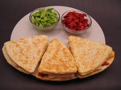 the sandwich is cut in half and ready to be eaten with other ingredients on the plate