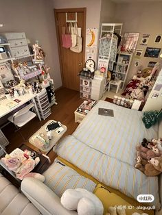 a room filled with lots of stuff and stuffed animals on top of couches in front of a computer desk