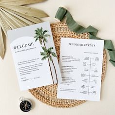 two palm trees are on top of the wedding program and some green ribbon is laying next to it