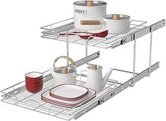 two metal shelves holding pots and pans on top of each other with dishes in them