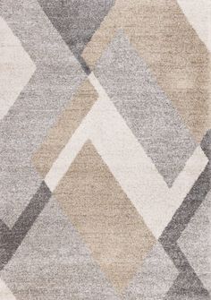 an area rug with various colored squares on it, including one in grey and the other in beige