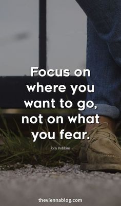 someone is standing on the ground with their feet up and there is a quote that says focus