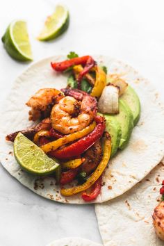 shrimp, bell peppers and avocado on a tortilla