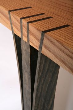 a close up of a wooden table with metal strips