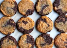 chocolate chip cookies sitting on top of a white counter