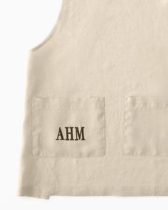 an apron with the word aha printed on it's front and side pockets