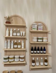 two wooden shelves filled with different types of skin care products