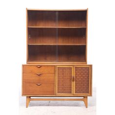 a wooden cabinet with two doors and drawers