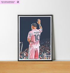 a framed photograph of a soccer player on a shelf