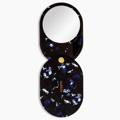 the compact mirror is black with blue speckles