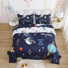 this is an image of a bed with space themed comforters and pillowcases