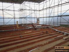 the interior of an abandoned building with scaffolding and wood flooring on it