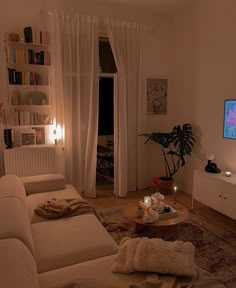 a living room filled with furniture and a flat screen tv