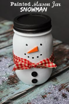 a painted mason jar with a snowman on it and the words painted mason jar