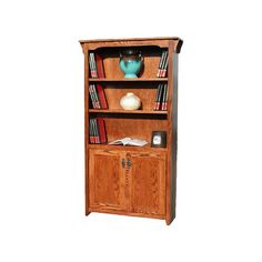 a wooden bookcase with books and vase on top