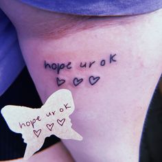 a woman with a tattoo on her neck that says hope urk hope u ok