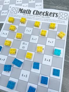 a close up of a game board with legos on it and the words math checkers written in large letters