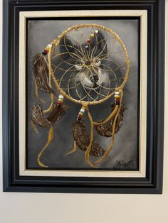 a painting of a bird with feathers and beads