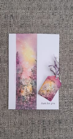 two greeting cards, one with an abstract painting and the other with a flower on it