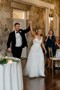 a bride and groom dancing at their wedding reception