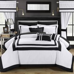 a black and white bed in a bedroom