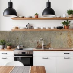 the kitchen is clean and ready to be used for cooking or baking, while also being used as a dining area