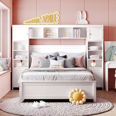 a bedroom with pink walls and white furniture