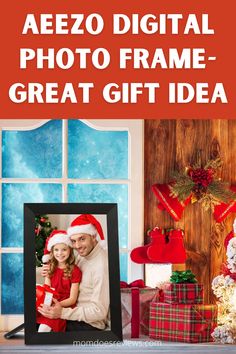 a man and woman in santa's hats are posing for the camera with presents around them