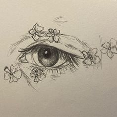 a drawing of an eye with flowers around it