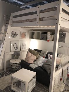 a loft bed with a couch underneath it