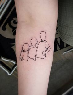 a small family tattoo on the arm