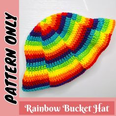 a crocheted rainbow bucket hat is shown with the words pattern now on it