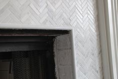 a white brick fireplace in a room