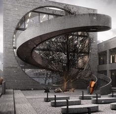 an artistic photo of a spiral staircase in front of a building with stairs leading up to it