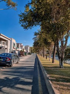 cars parked on the side of an empty street