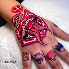 a person's hand with tattoos on it